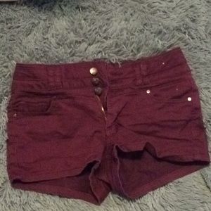 Maroon jean shorts.
